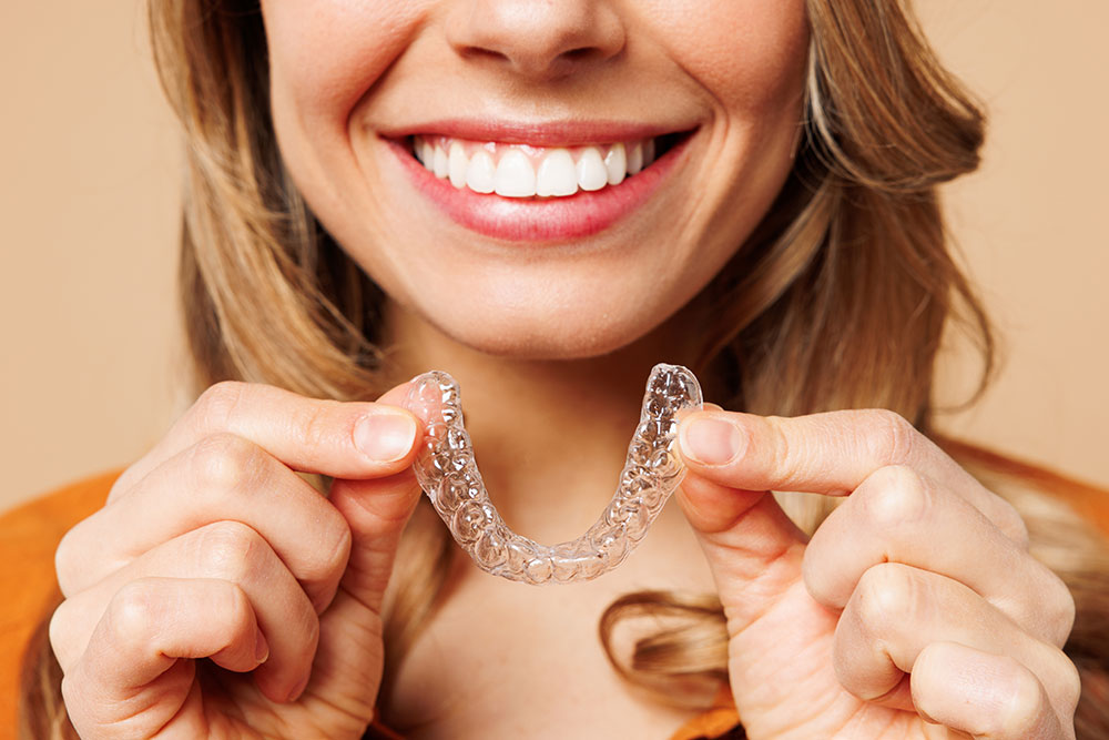 Beyond aesthetics, clear aligners treat a wide variety of functional issues. image of clear aligner